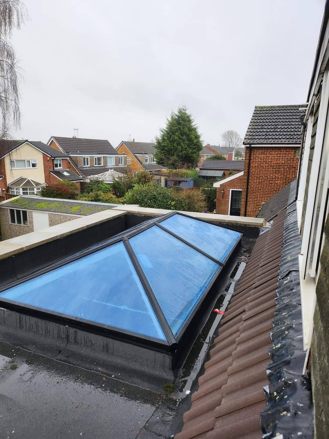 Flat roof lantern skylight installation on residential extension